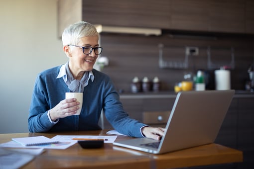retired woman investing laptop 401K IRA