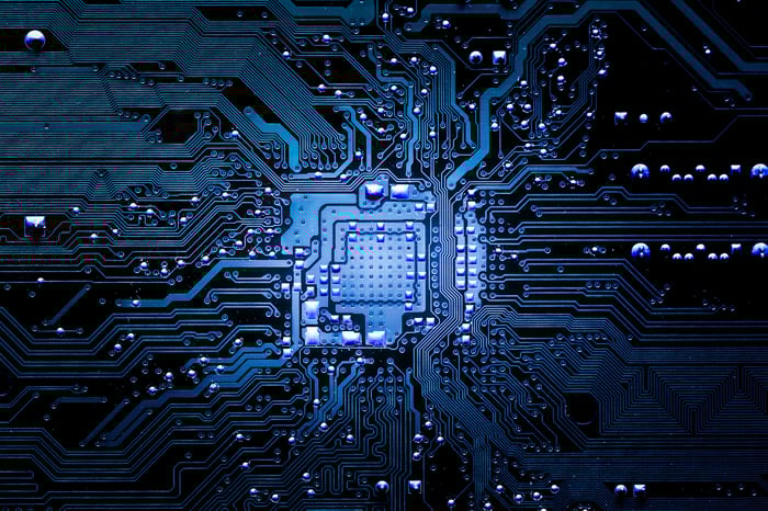 A chip animation with electronic signals beaming out across transistors.