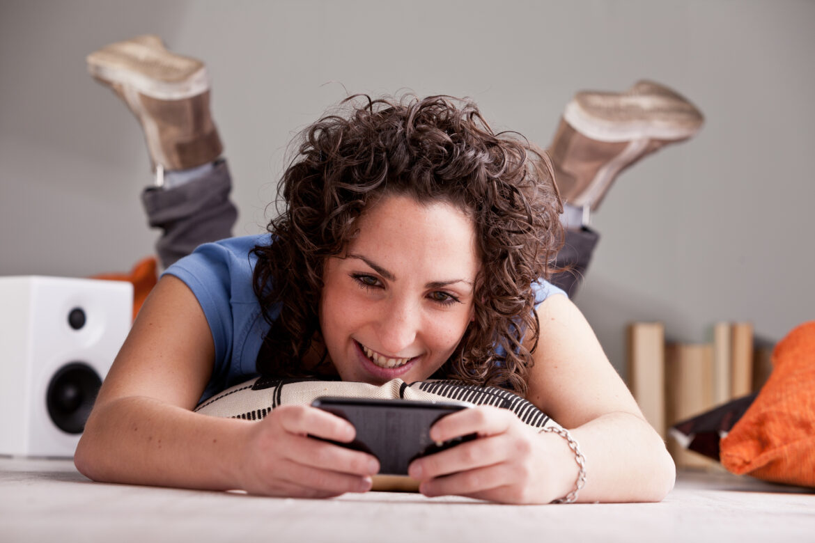 person-laying-on-the-ground-using-their-phone.jpg