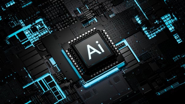 A digital render of a circuit board with a chip in the center, inscribed with the letters AI