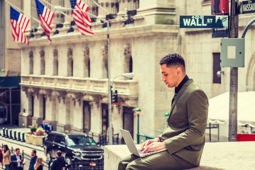 Wall Street, young man with laptop