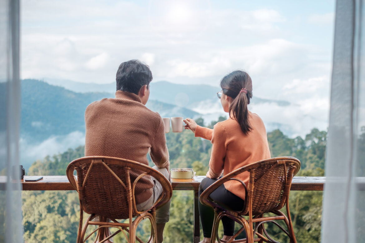 couple-enjoying-coffee-overlooking-a-mountain.jpg
