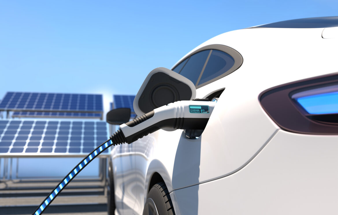 electric-vehicle-with-charger-plugged-in.jpg