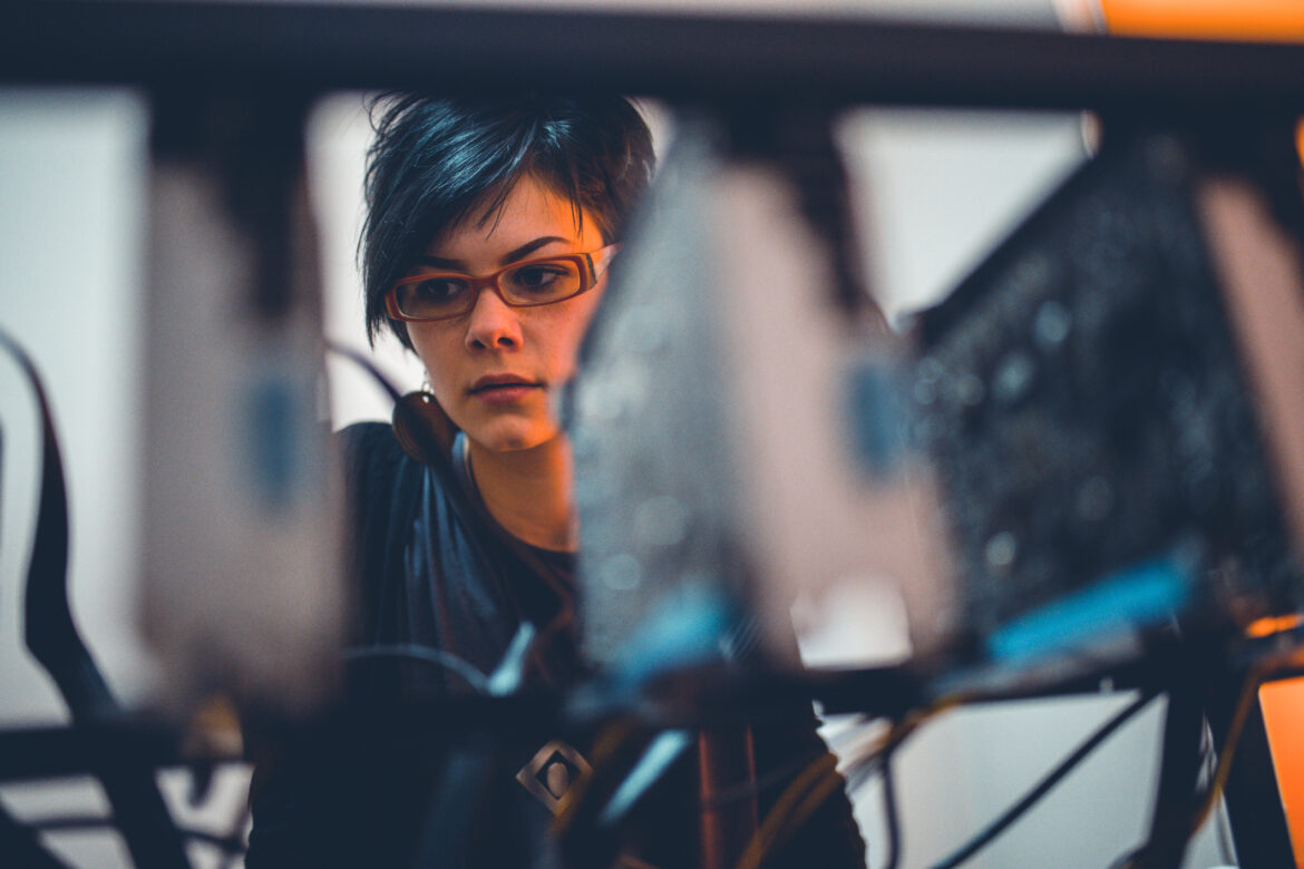 person-inspecting-a-rack-of-gpus.jpg