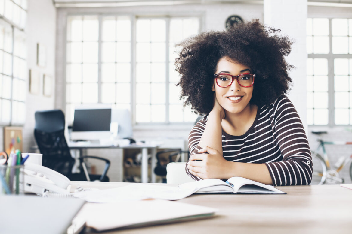 woman-20s-smiling-table-gettyimages-523255696.jpg
