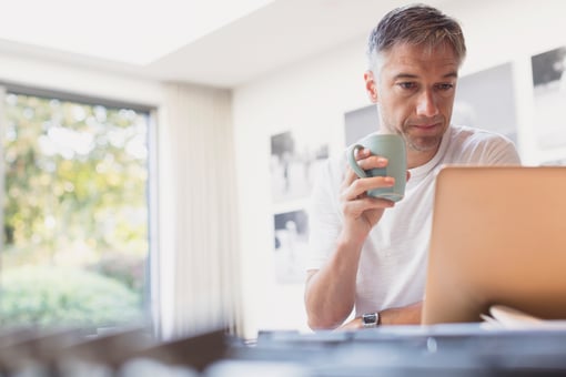 Man middle aged at laptop GettyImages-656287813