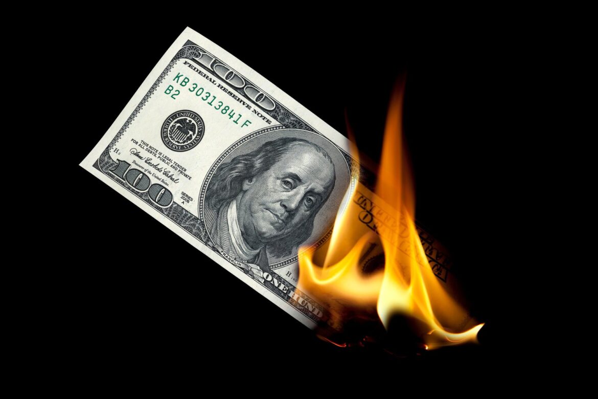 burning-money-hundred-dollar-bill-100.jpeg