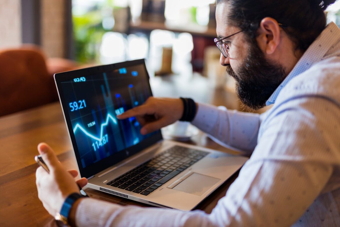 businessman-using-laptop-for-analyzing-data-stock-market.jpg