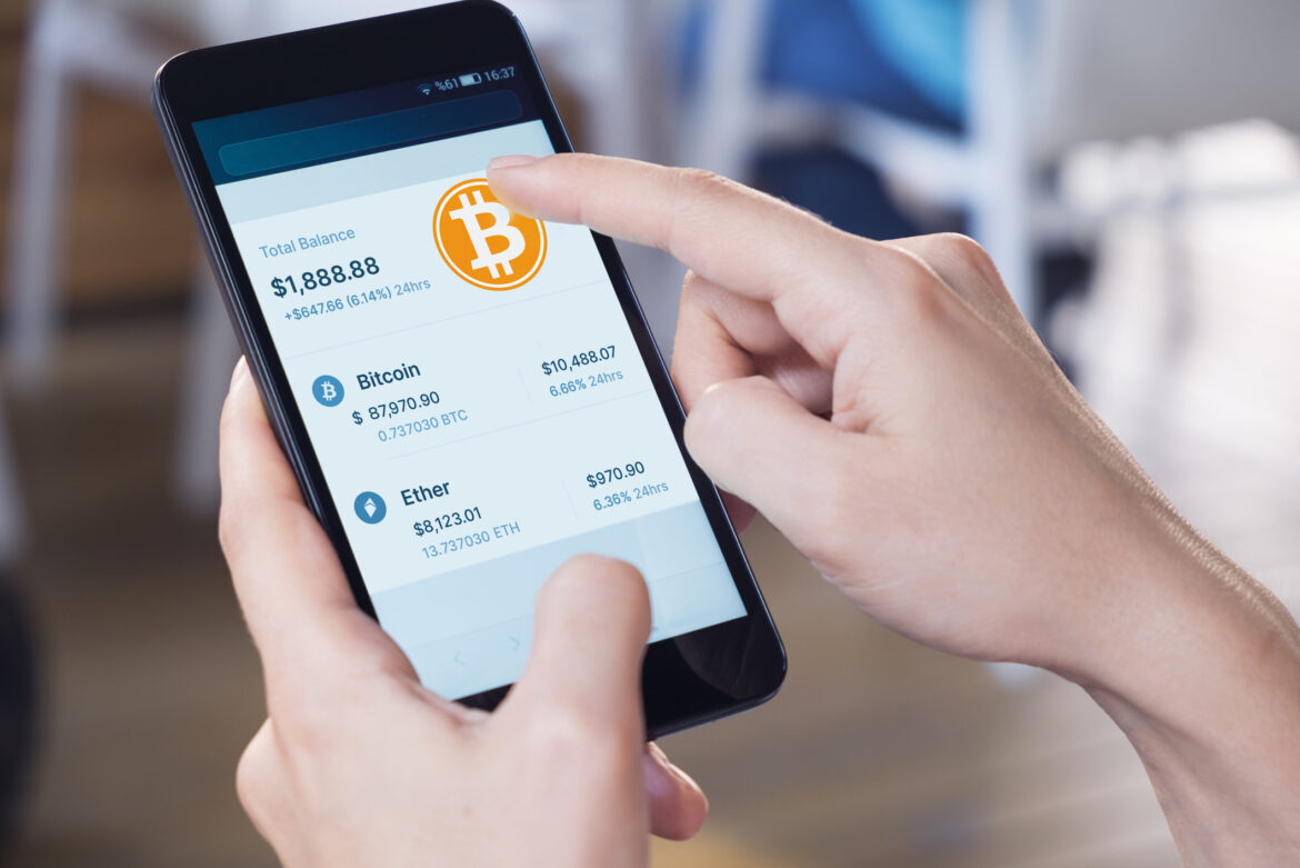 person-trading-bitcoin-in-a-wallet.jpg