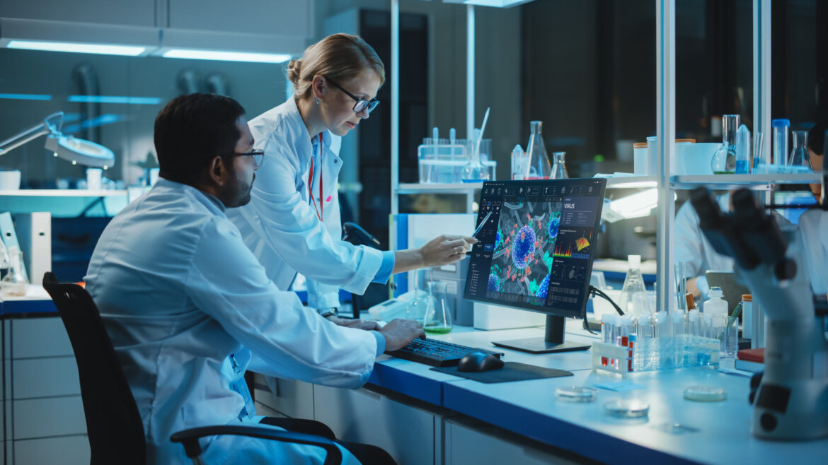 scientists-examine-cell-make-up-microscope-biotech.jpg