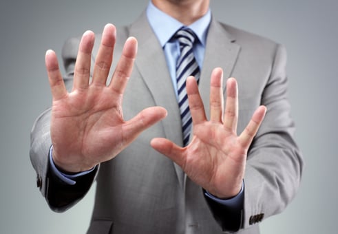 Businessman Holding Hands Up Stop Avoid Getty