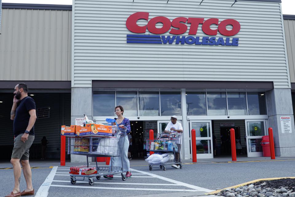 Customers exiting Costco warehouse