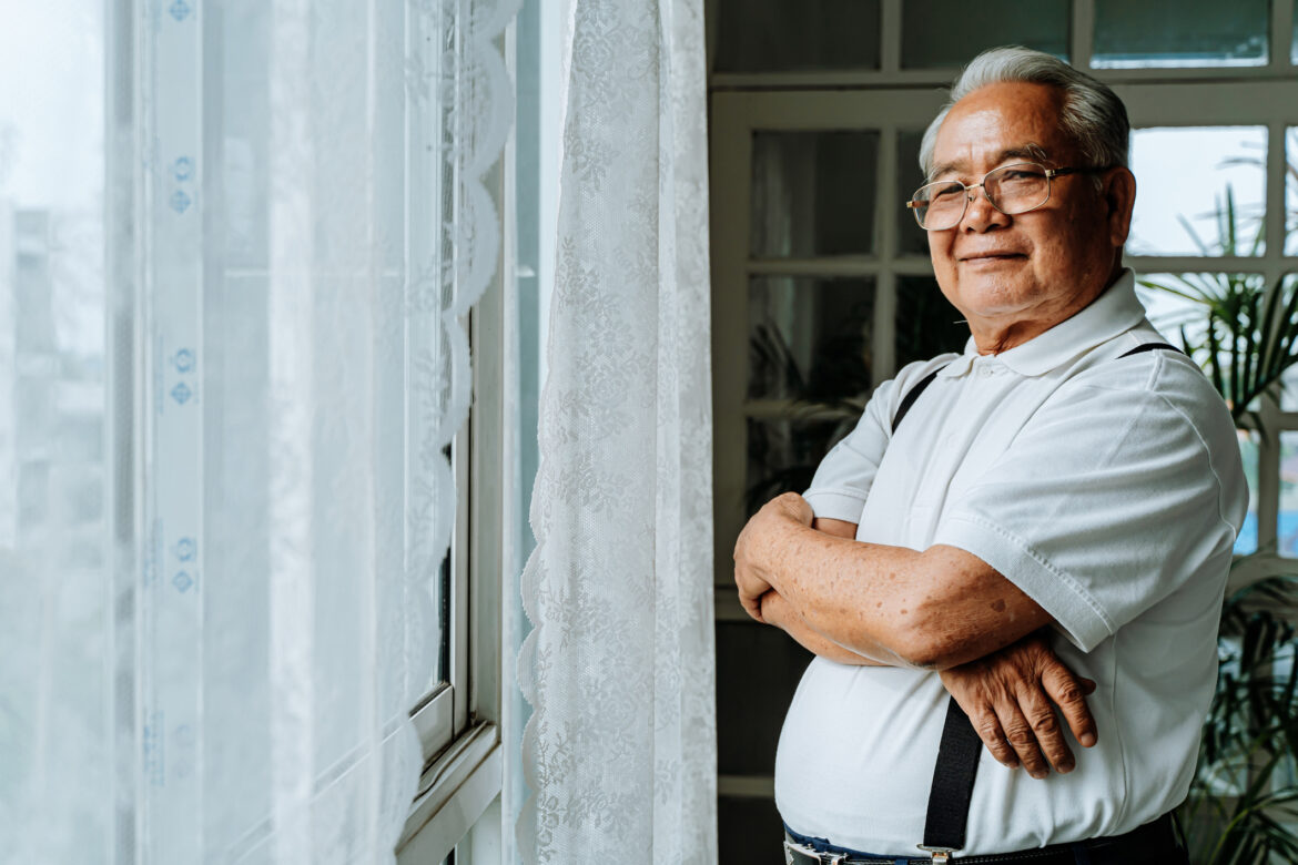 getty-smiling-senior-with-arms-crossed.jpg