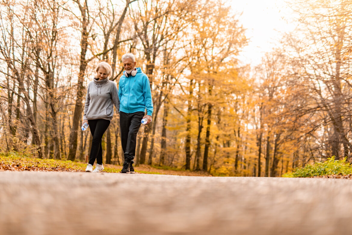 two-older-people-walking-in-a-park.jpg