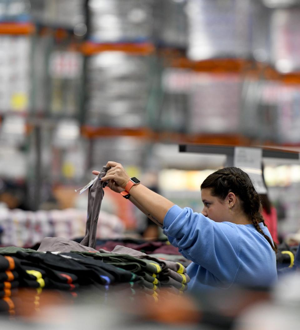 Lexi DeFrank of Canal Fulton looks through clothes at Costco Wholesale in Jackson Township. Thursday, August 17, 2023.