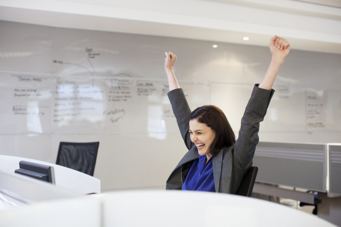 businessperson-celebrates-in-an-office-setting.jpg