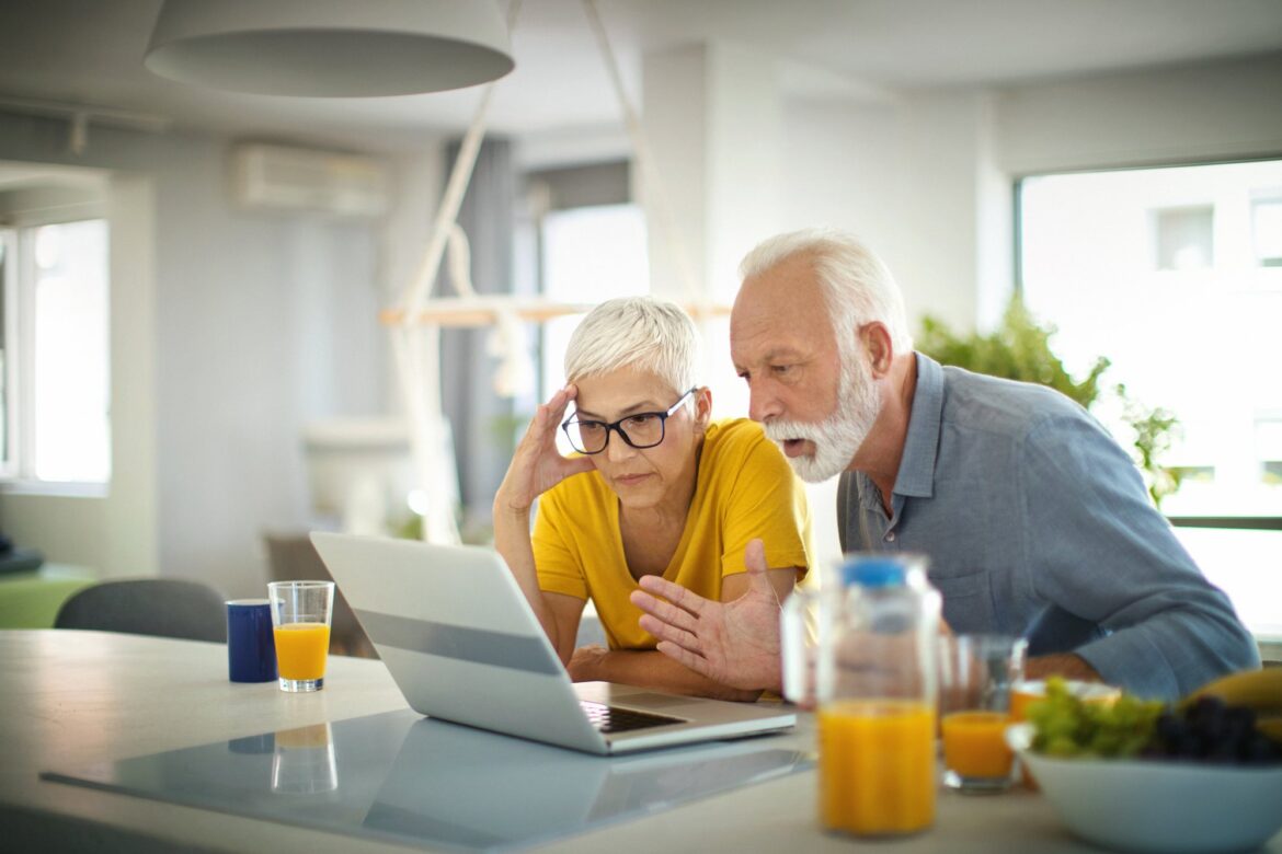 two-people-with-stunned-expressions-looking-at-laptop.jpg