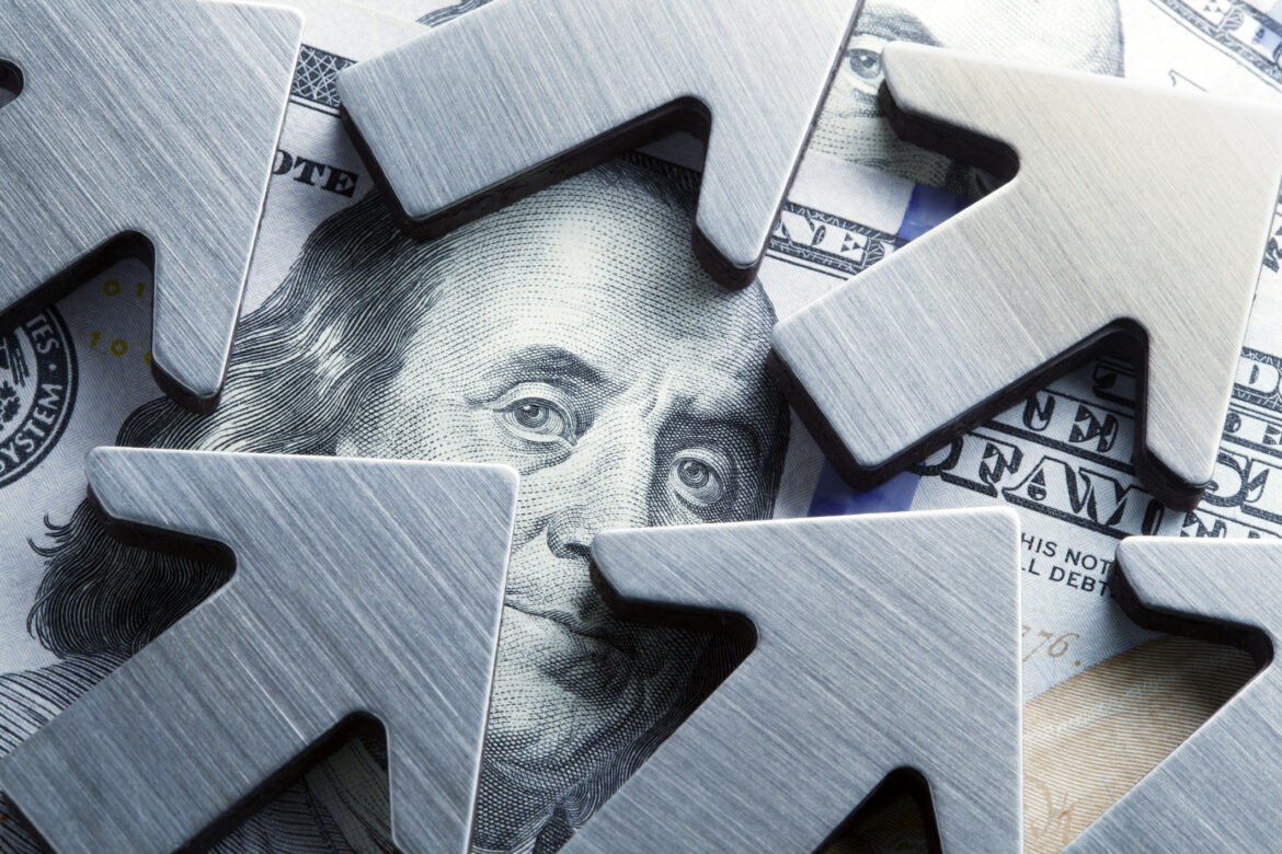 arrows-pointing-up-on-a-hundred-dollar-bill.jpg