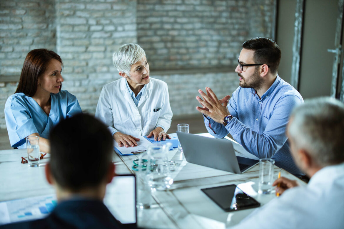 investor-talks-with-group-of-medical-professionals.jpg
