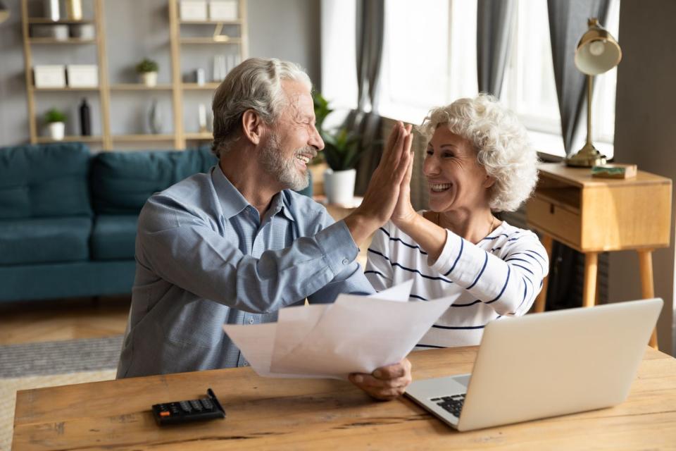 Retired couple celebrating their financial independence. 