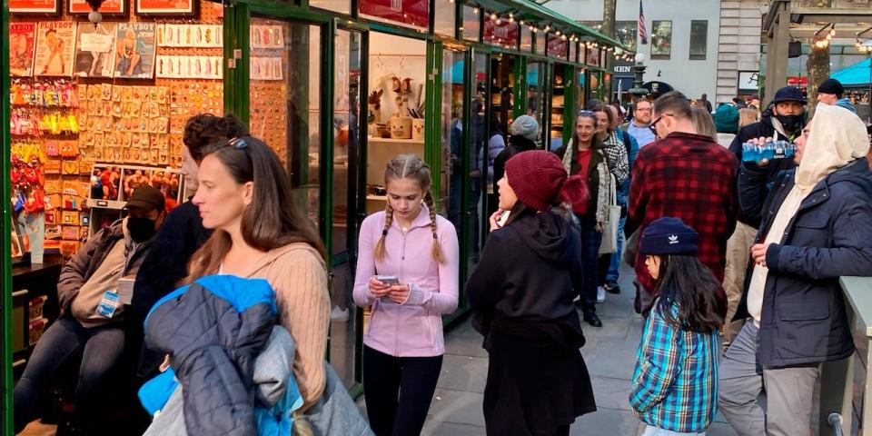 Shoppers at Bryant Park's Winter Village shopping area in Manhattan, New York.