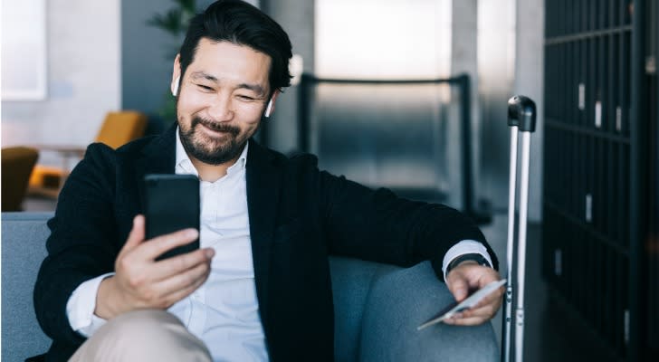 A man looks over his assets and calculates his net worth.