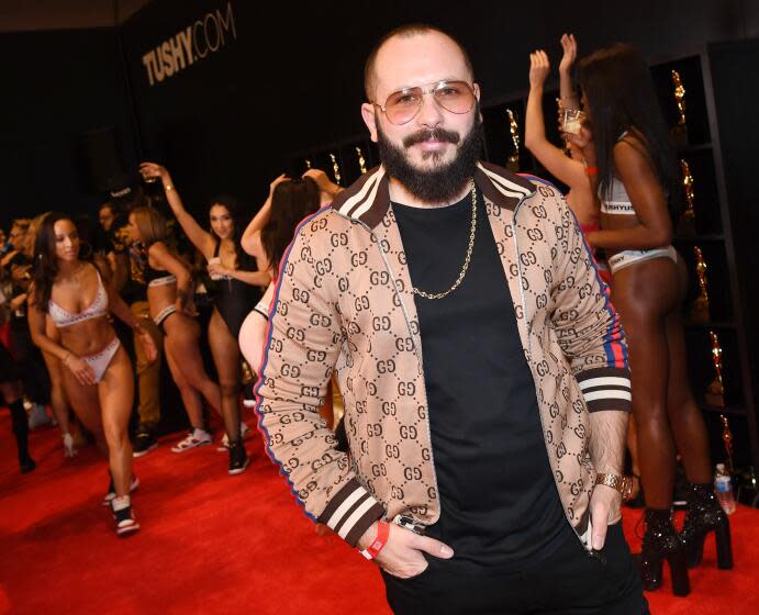 Adult film producer/director Greg Lansky poses at his Blacked, Tushy and Vixen adult studios booth.