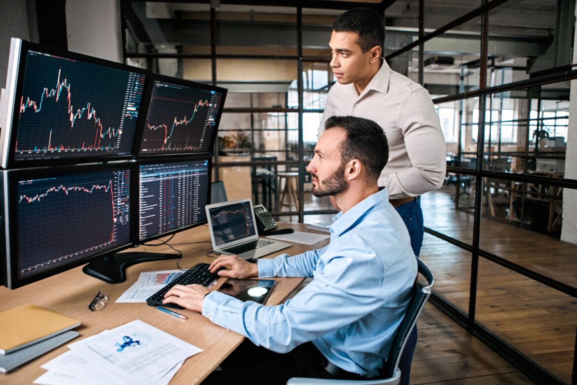 a-couple-of-investors-looking-at-a-series-of-charts.jpg