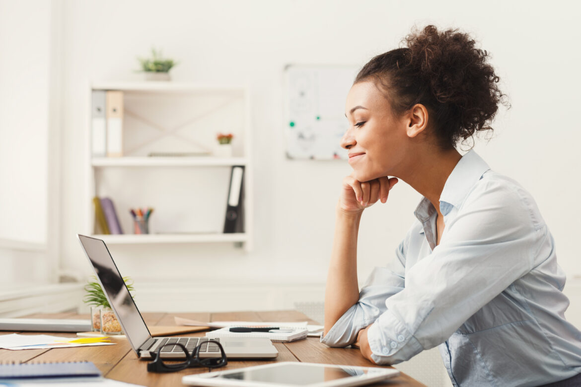 a-person-sitting-at-their-home-office-desk-using-a-laptop-computer.jpg