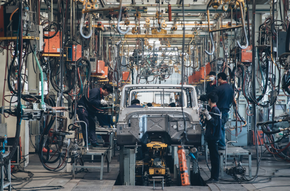 people-working-on-a-car-assmebly-line.jpg
