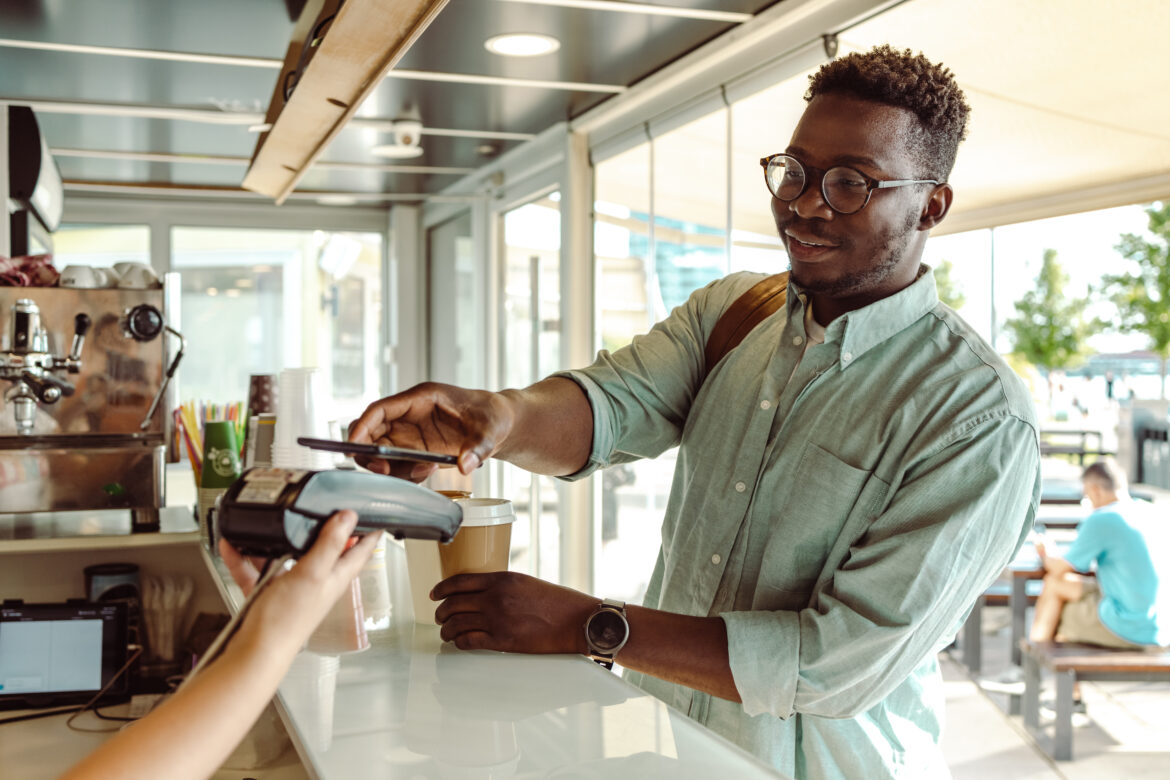 person-paying-with-a-credit-card-in-restaurant.jpg