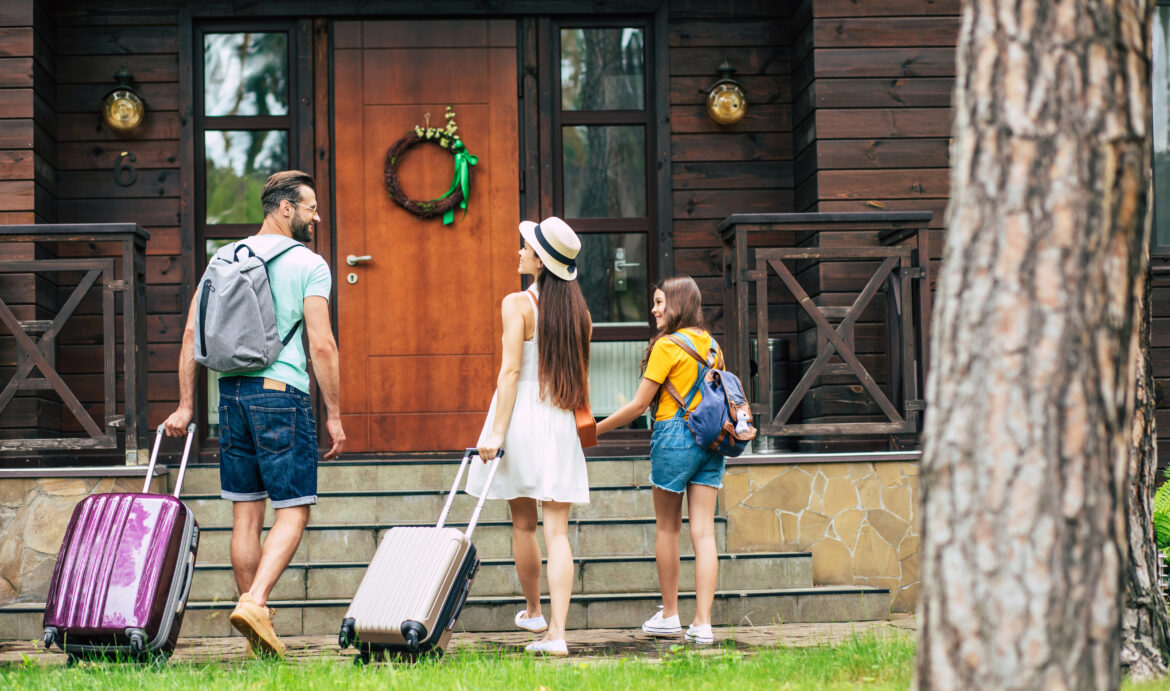 vacation-family-heading-into-a-rental-cabin-airbnb-lease-property.jpg