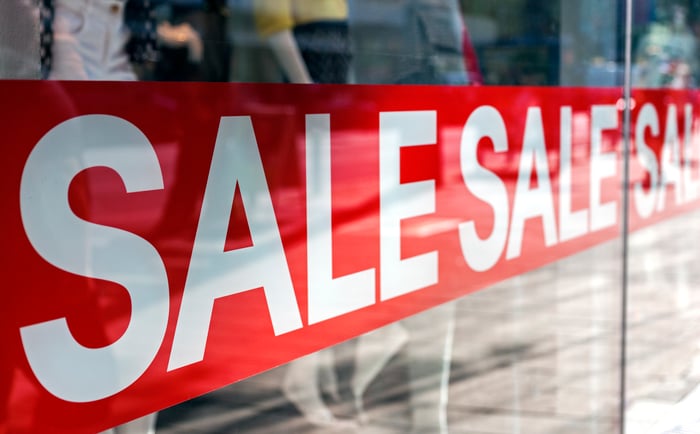 Sale signs in a store window.