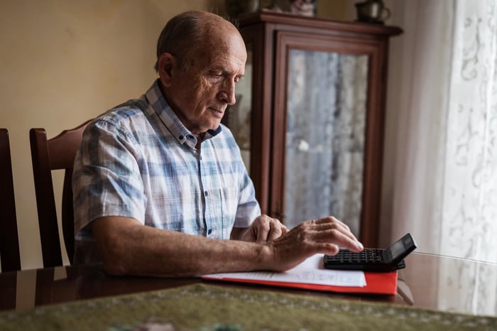 A person using a calculator.