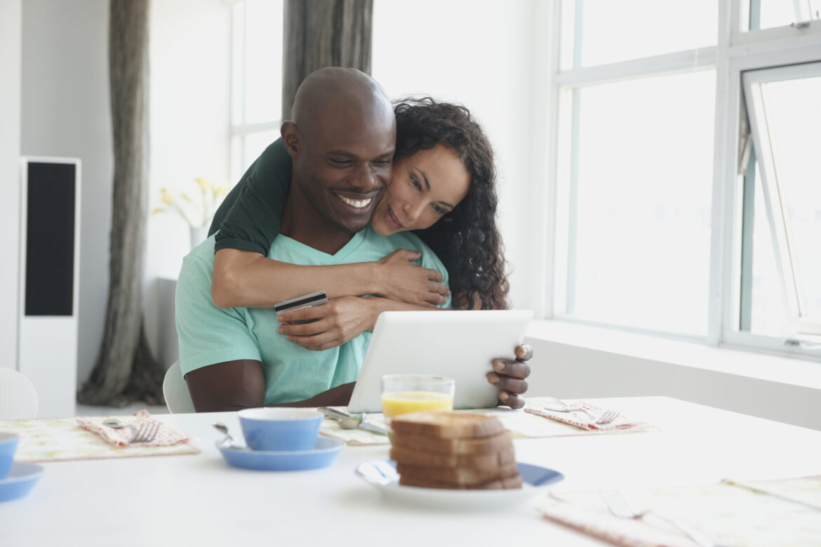 a-couple-looking-at-a-tablet-during-breakfast.jpg