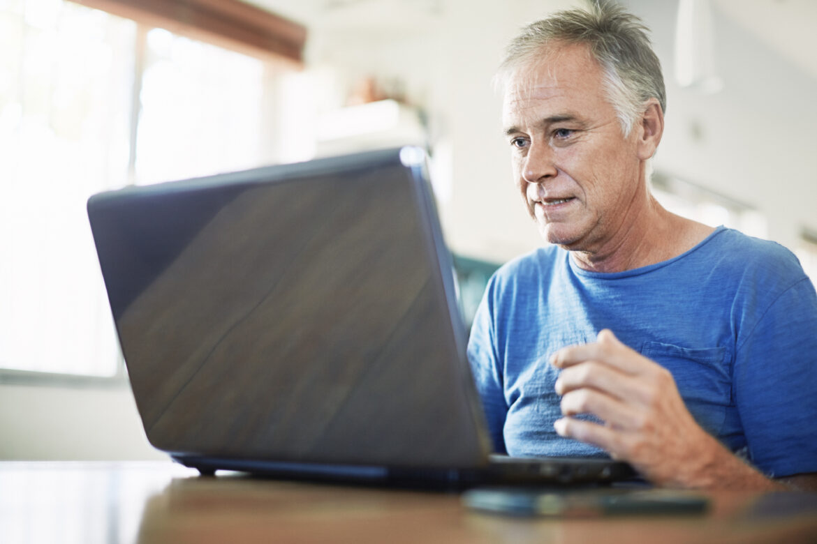 man-50s-laptop-gettyimages-1371314132.jpg