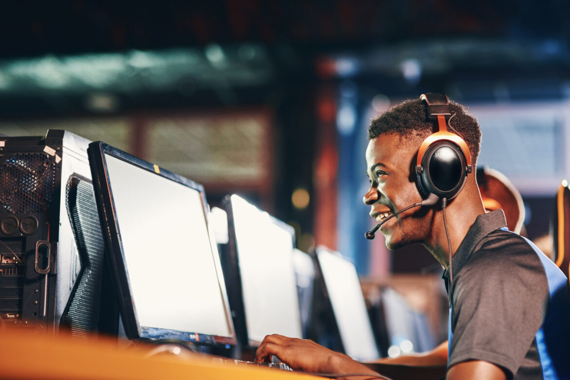 man-wearing-headphones-and-looking-at-a-computer.jpg