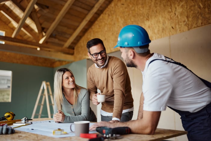 A couple building a house.