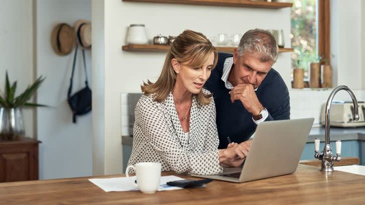 A couple reviews the beneficiary designations on their payable on death (POD) and transfer on death (TOD) accounts.