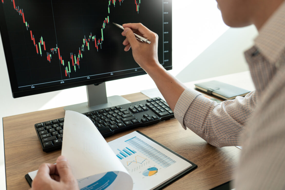 a-person-analyzing-a-stock-price-chart-on-a-computer.jpg