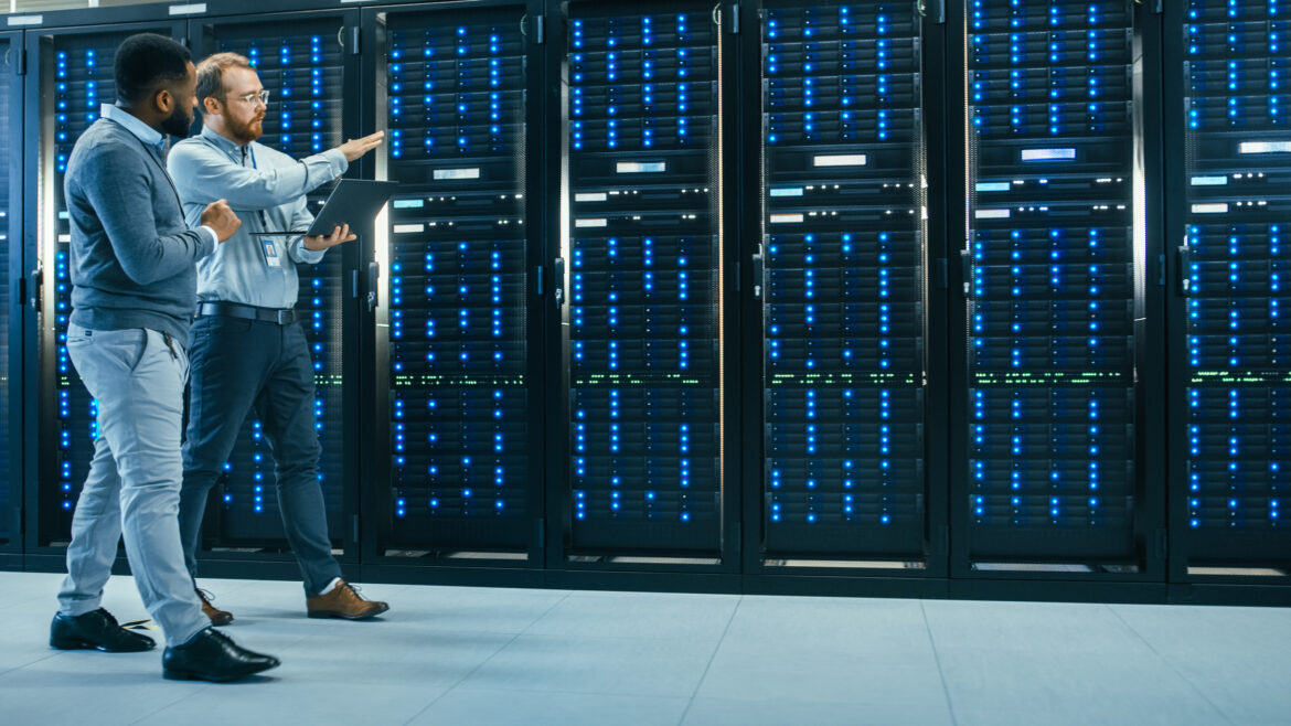 two-people-walking-in-a-data-center.jpg