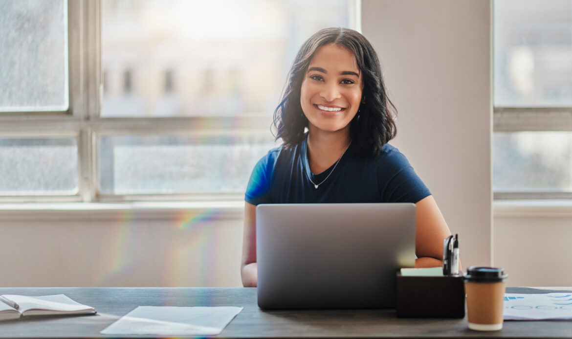 woman-20s-smiling-laptop-gettyimages-1430319207.jpg