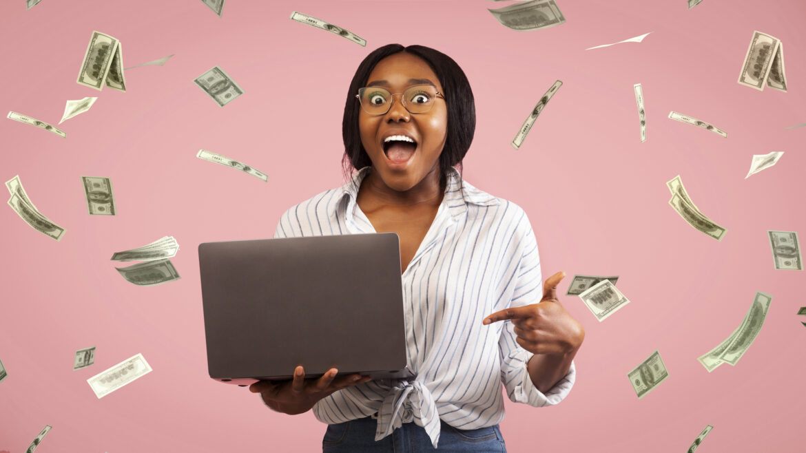 young-woman-celebrating-in-a-shower-of-cash.jpg