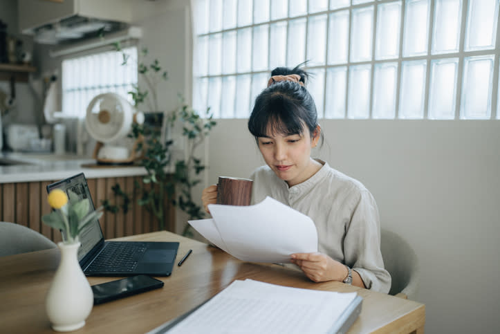 A woman preserving her tax documents in case she gets audited.