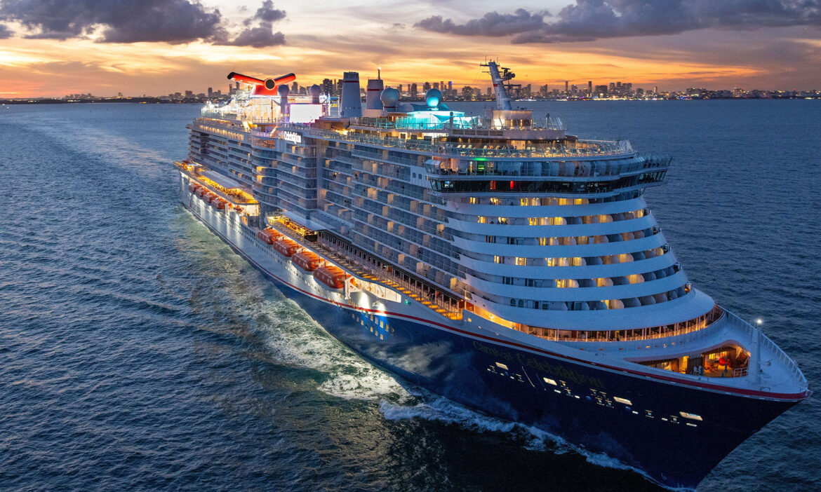 carnival-cruise-line-ship-at-sunset-with-lights-on_carnival_cruise_lines_ccl.jpg