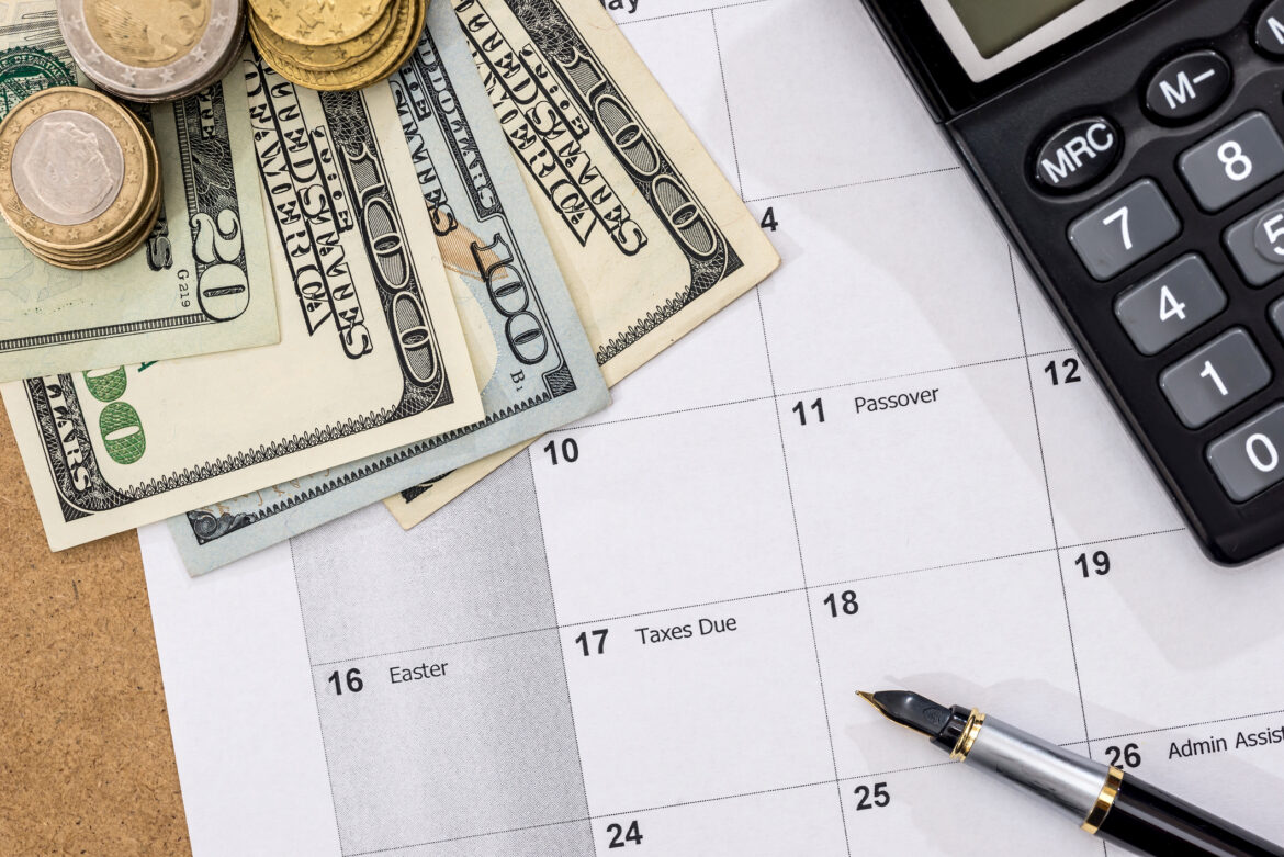 dollar-bills-and-coins-on-a-calendar.jpg