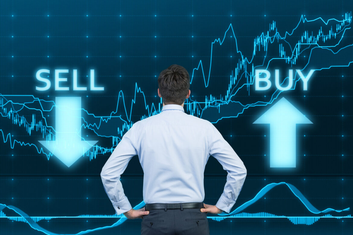 graph-businessman-considering-to-buy-or-sell-stocks.jpg