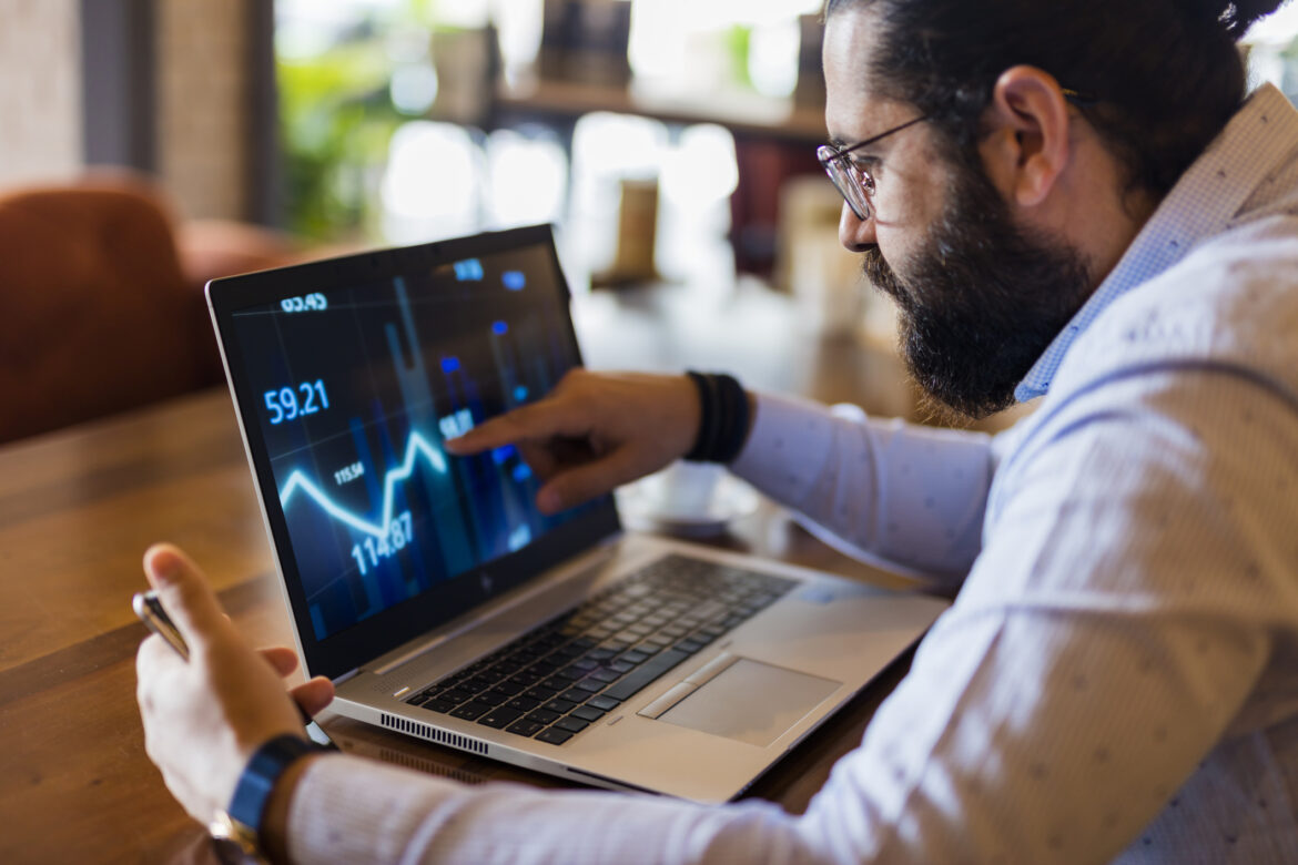 man-in-specs-looking-at-a-line-chart-on-a-laptop.jpg