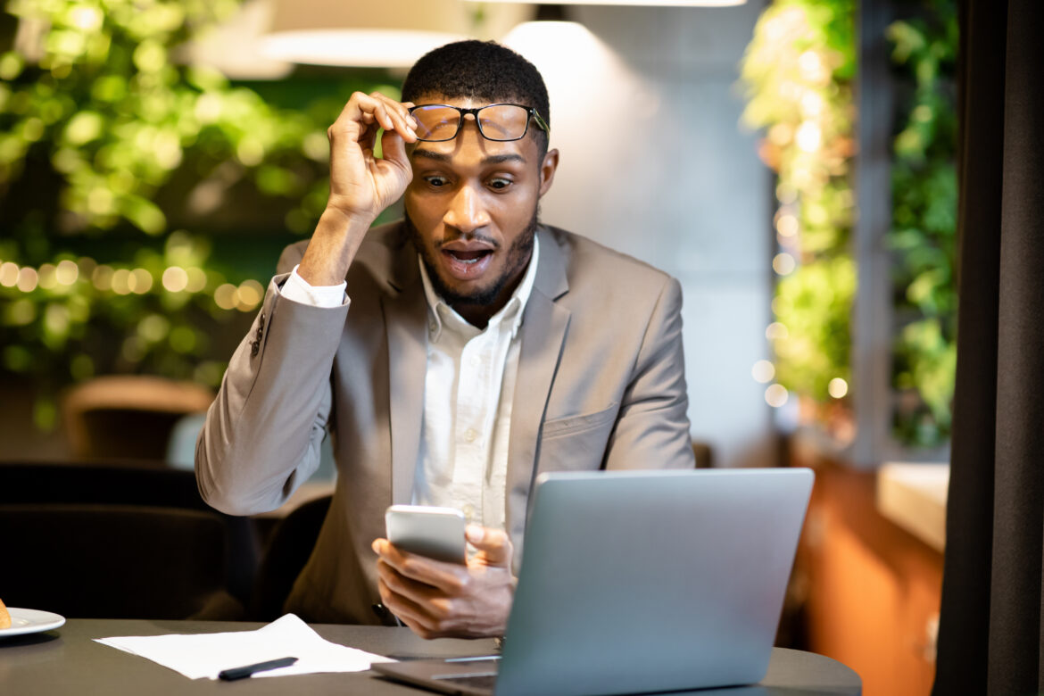 stock-investor-looking-at-their-phone-surprised.jpg